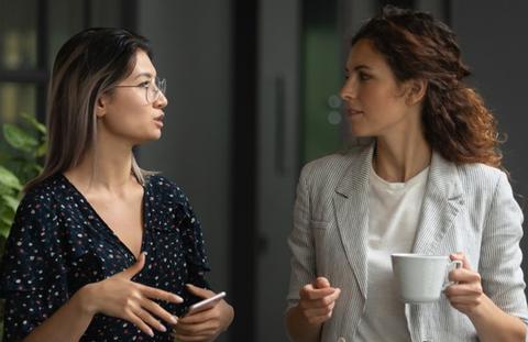 Two participants engaging in an open dialogue after the training at Coaching The Shift.